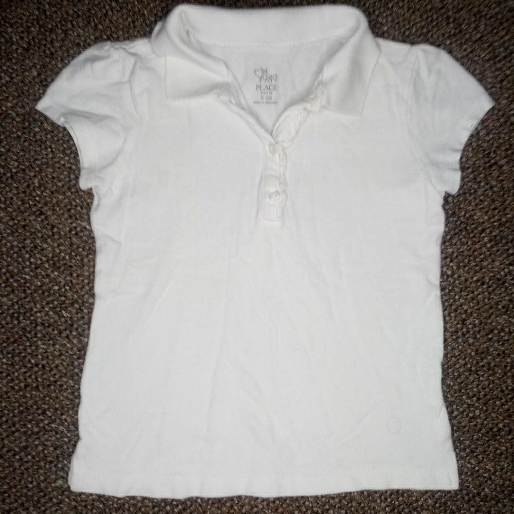 White polo with ruffle on neckline